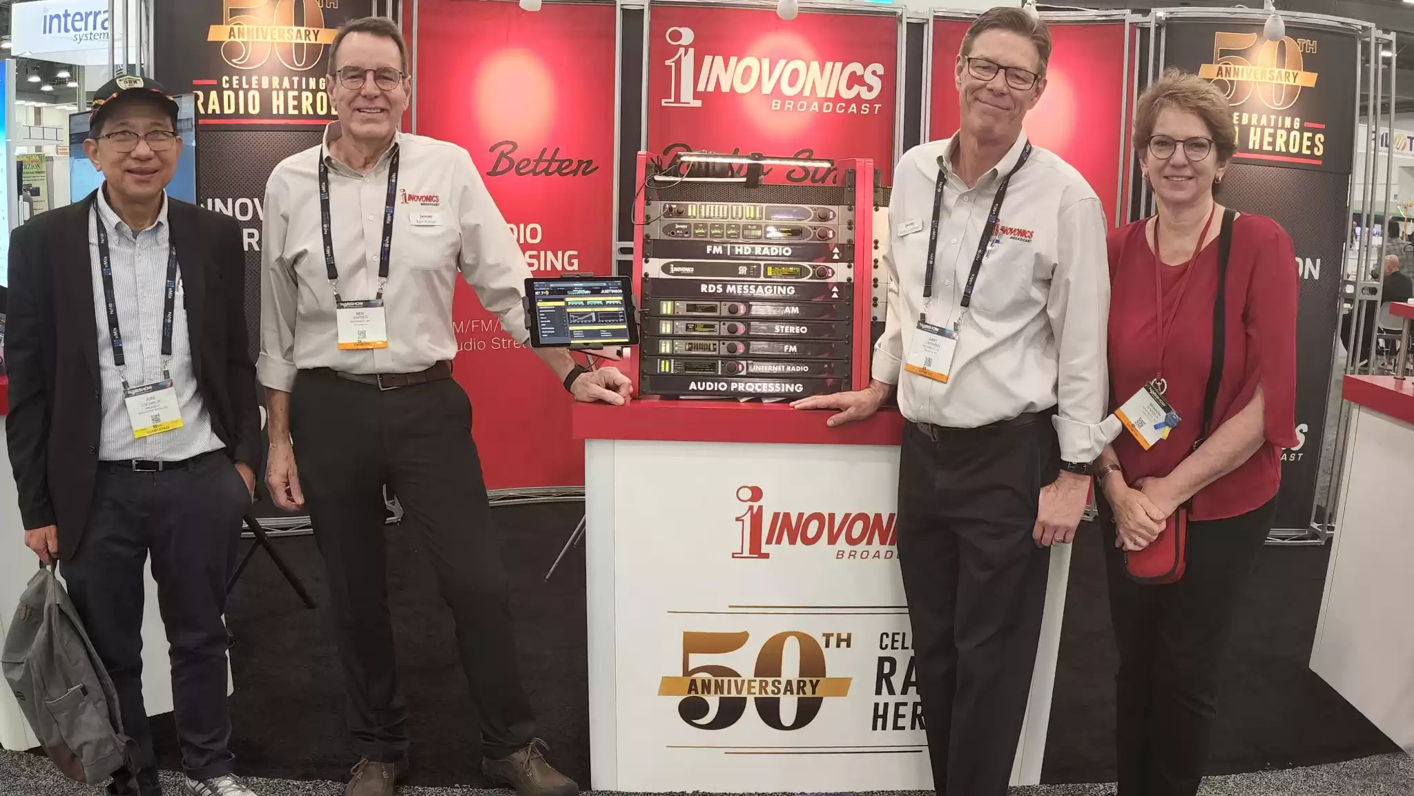 Mr. Jose Locsin (left) at the Inovonics Inc. Booth with Ben Barber, Gary Lhurman, and Sharon Barber